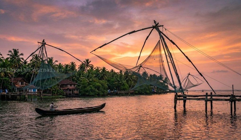 Kumbalangi Nights movie location: Chinese fishing nets at sunset in Kochi, Kerala.