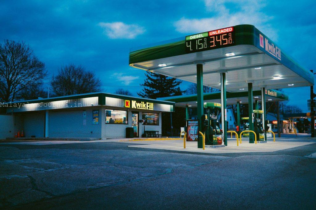 A gas station sits under the night sky.